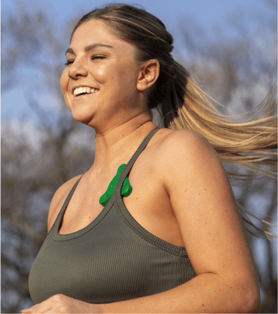 Woman wearing the ADAMM wearable respiratory monitor
